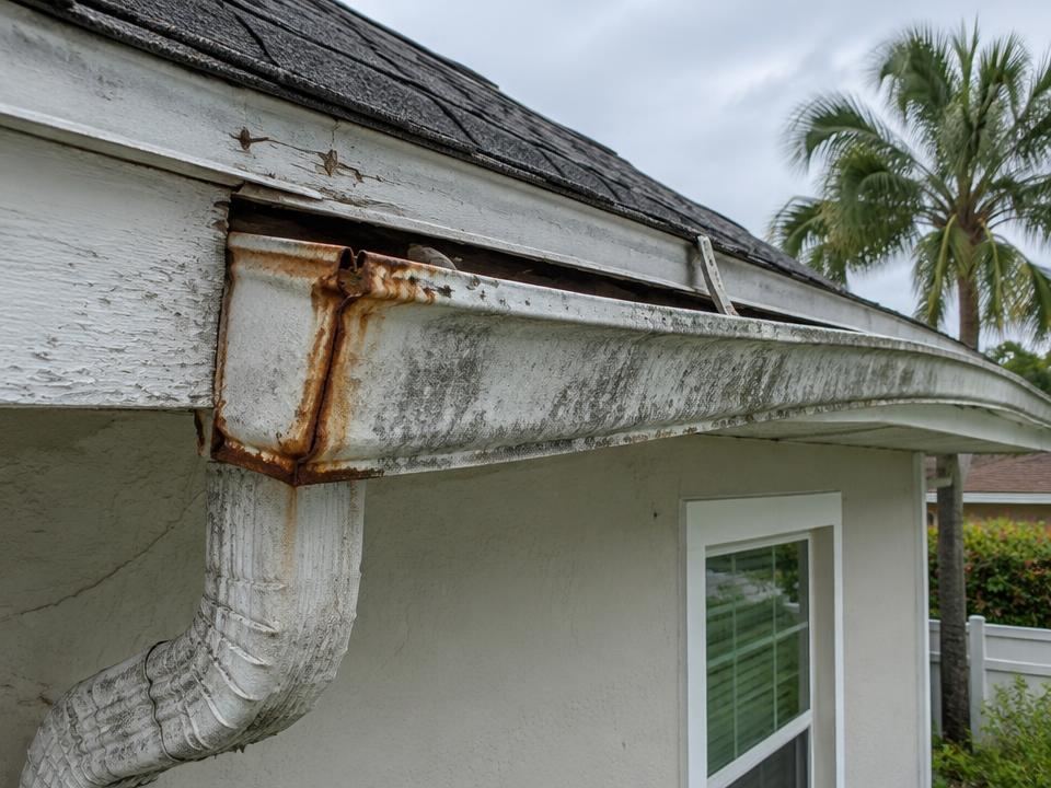 Weathered rusted gutter showing signs that replacement may be needed